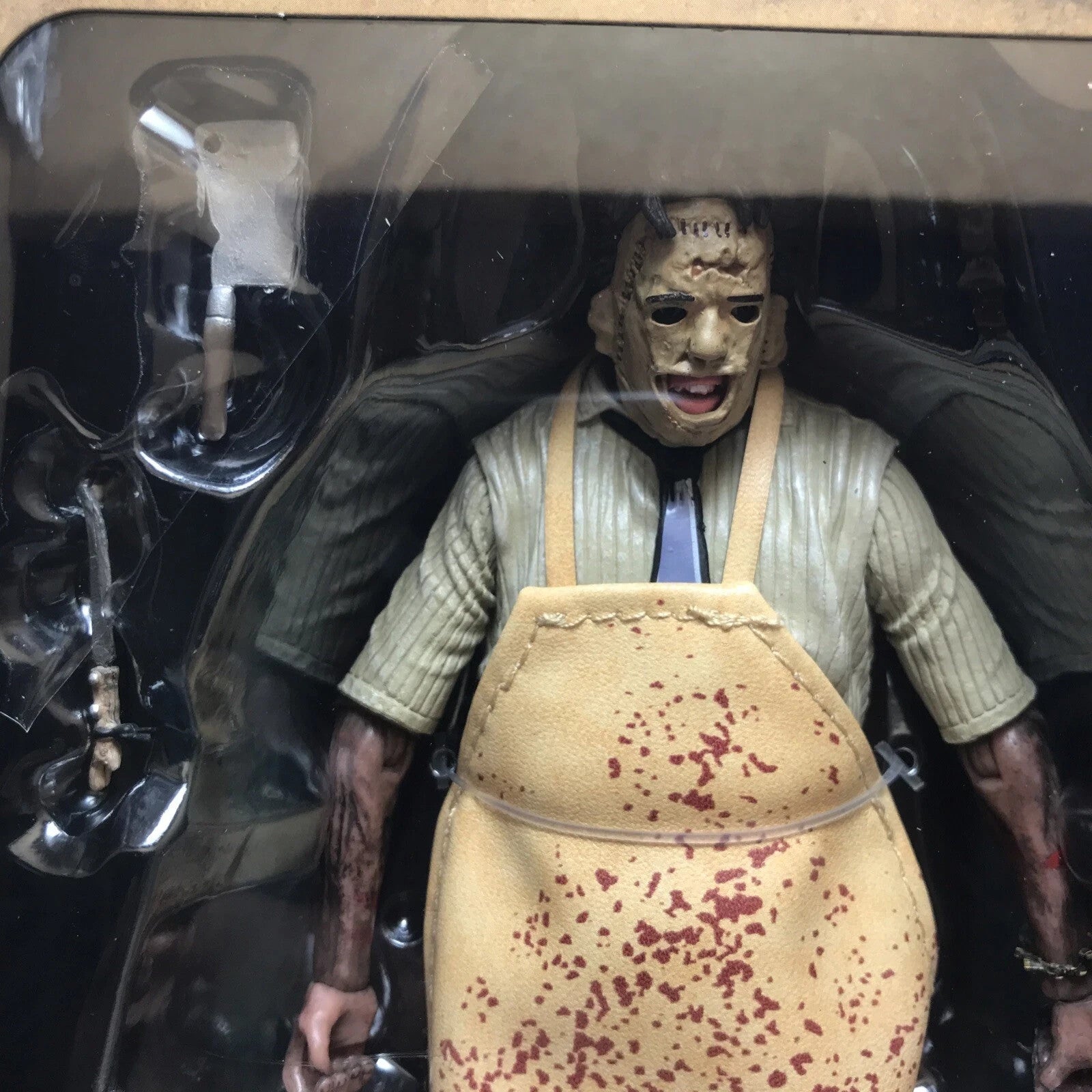 Leatherface horror figure in bloodstained apron and mask with detailed arms and butcher tools