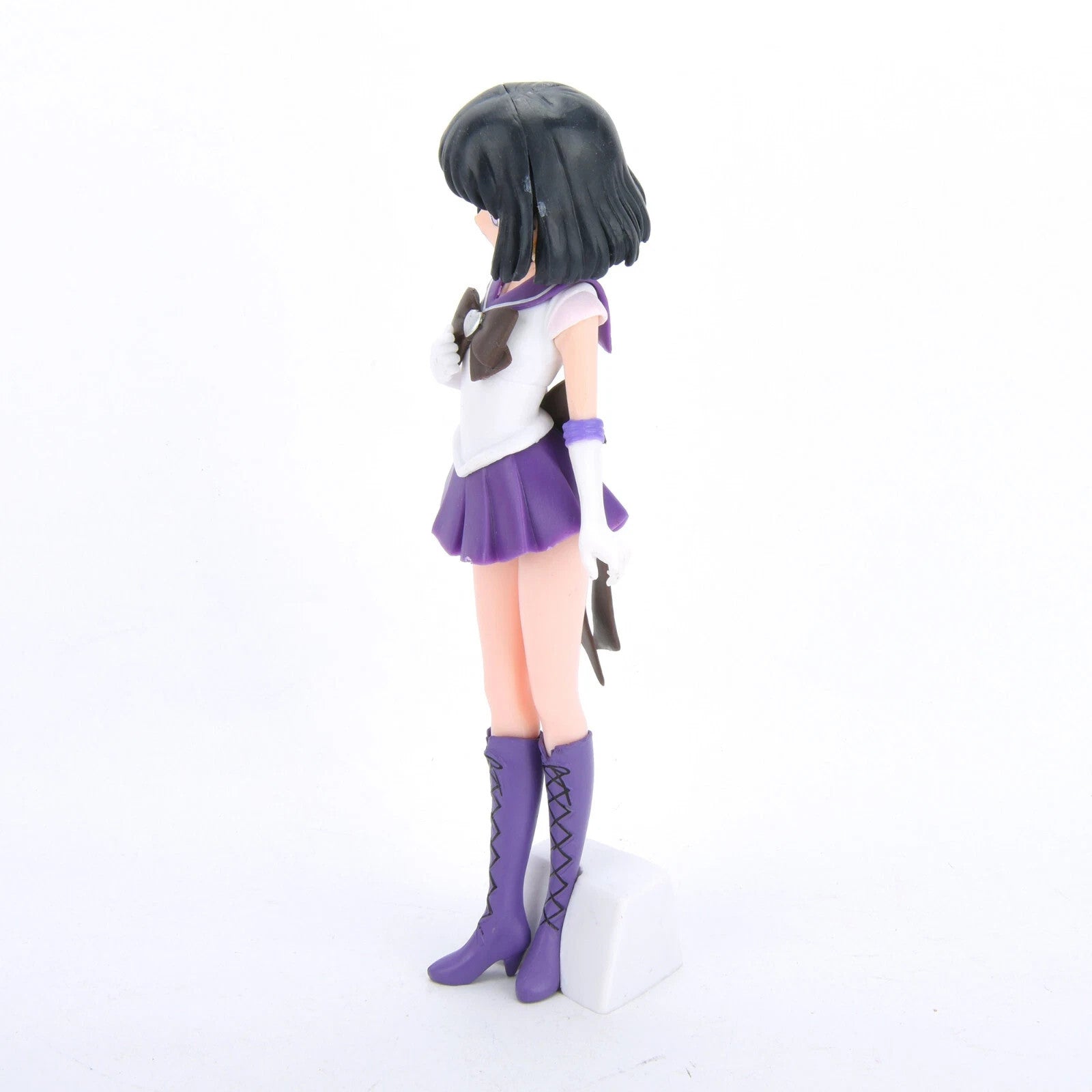 Sailor Saturn anime figure in white and purple school uniform with black hair on white background