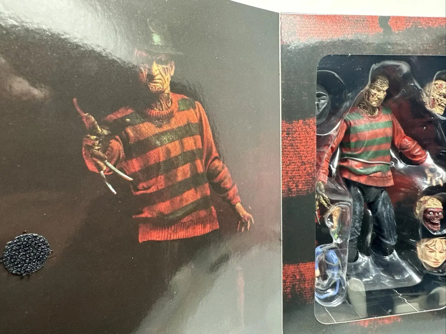 Freddy Krueger horror action figure with striped sweater and interchangeable heads in packaging