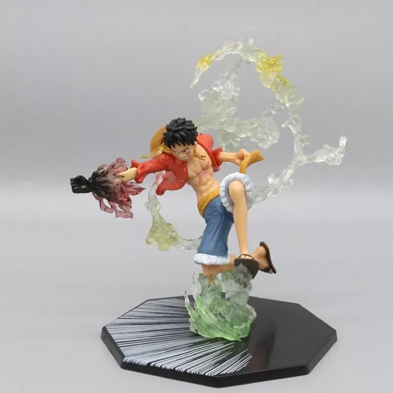 One Piece Luffy anime figure in dynamic pose with fire effects on octagonal black display base