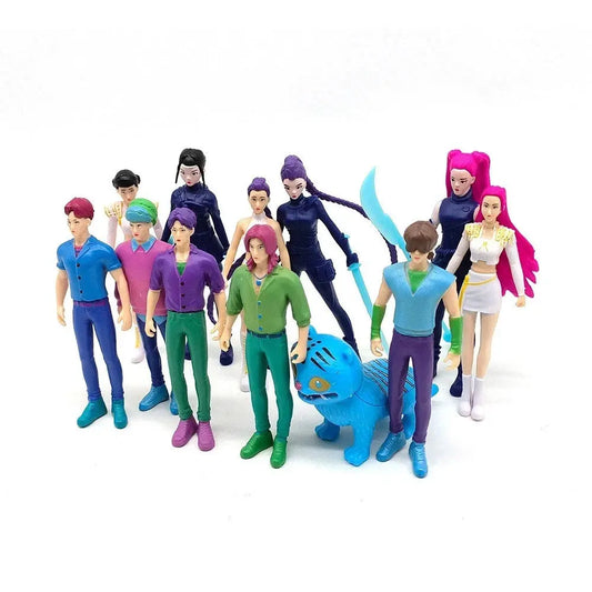 Collection of colorful anime-style action figures and a blue tiger toy on white background