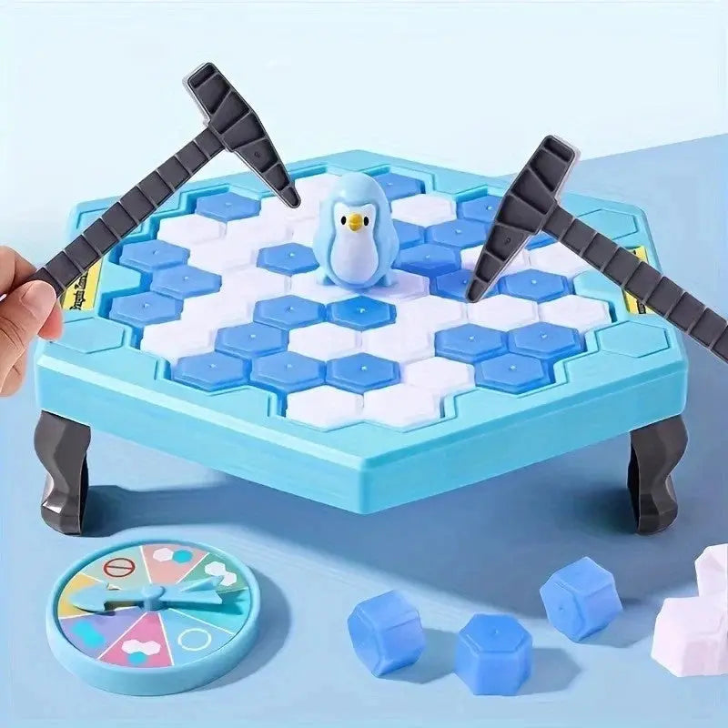 Icebreaker penguin game with blue and white hexagonal ice blocks, two black plastic hammers, and a spinner on a light blue table