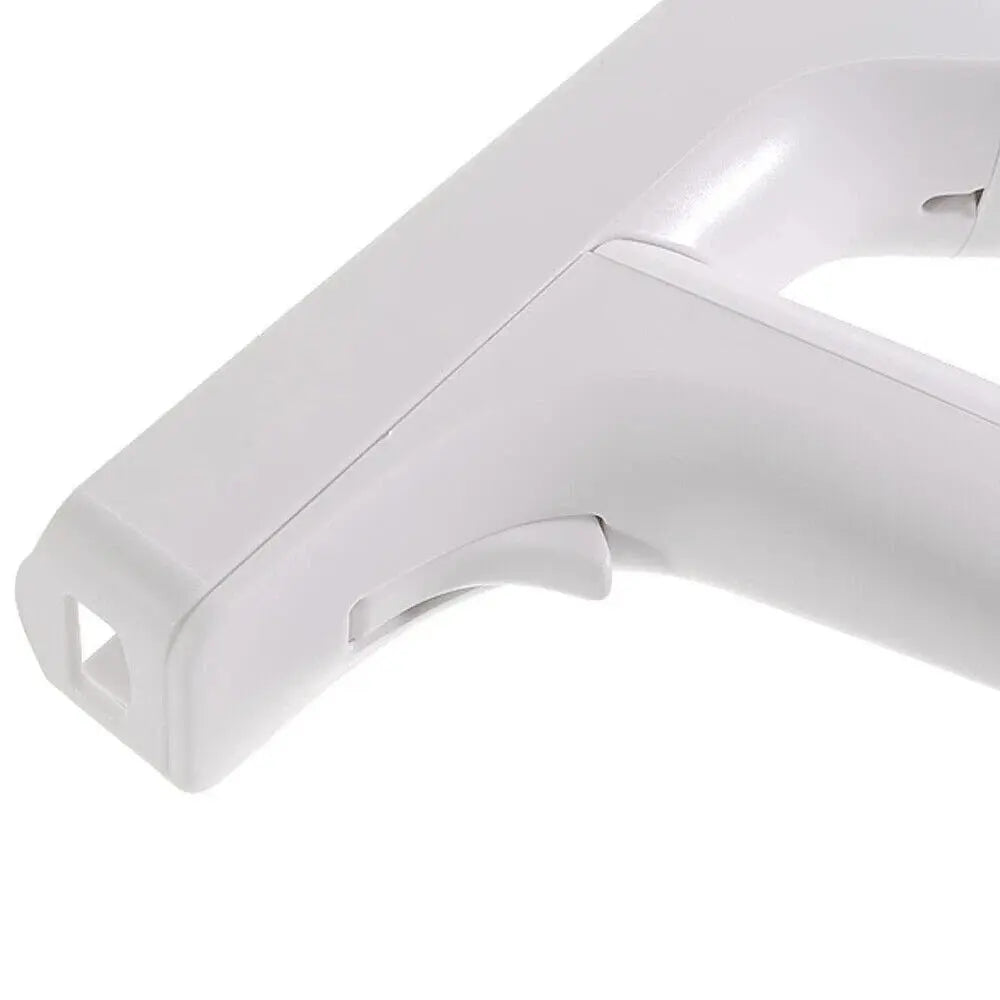 Close-up of white plastic spray bottle trigger handle with ergonomic grip and nozzle