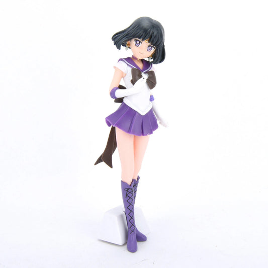 Sailor Saturn anime figurine in purple skirt and boots with white gloves on white background